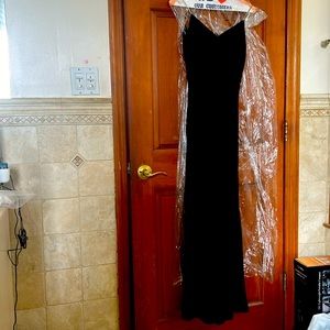 Long black formal dress. Size 4. Fully lined, rhinestone straps.